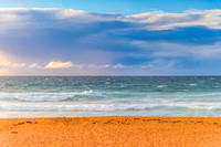 Seaside Sunrise with a hint of rain in the clouds