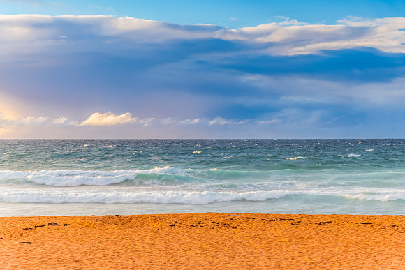 Seaside Sunrise with a hint of rain in the clouds