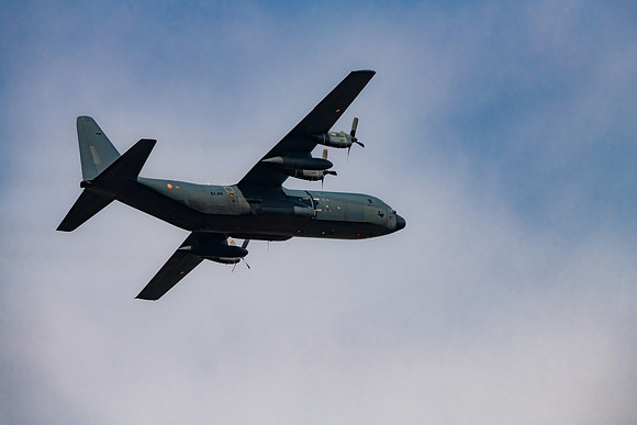 C 130 Hercules Military Aircraft Jet in the sky and clouds above