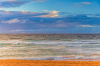 Seaside Sunrise with a hint of rain in the clouds