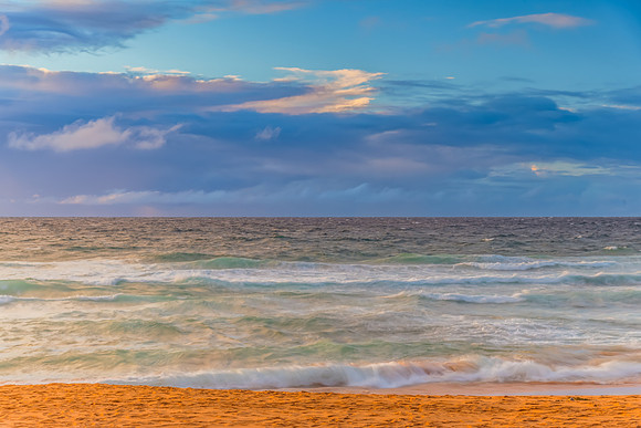 Seaside Sunrise with a hint of rain in the clouds