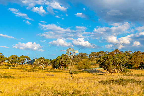 Snowy Monaro Region countryside under a blue Summer sky with clo