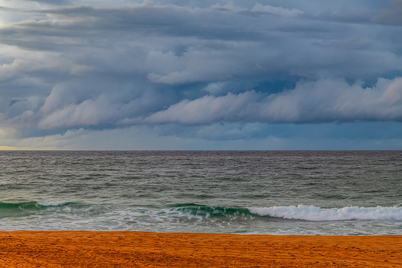 Sunrise at the Seaside with rain clouds