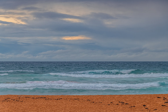 Seaside Sunrise with a hint of rain in the clouds