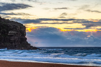 Seaside Sunrise with a hint of rain in the clouds