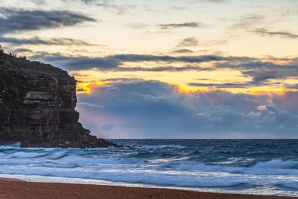 Seaside Sunrise with a hint of rain in the clouds