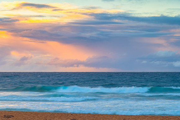 Seaside Sunrise with a hint of rain in the clouds