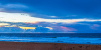 Seaside Sunrise with a hint of rain in the clouds