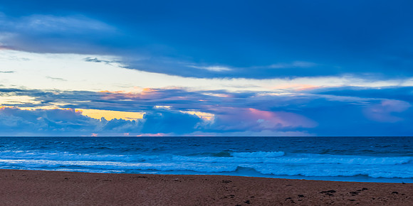 Seaside Sunrise with a hint of rain in the clouds