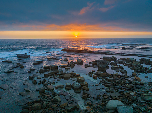 Hazy Summer Sunrise Seascape and Rocky Inlet