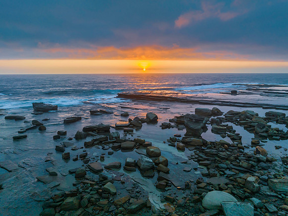 Hazy Summer Sunrise Seascape and Rocky Inlet