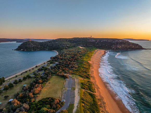 Sunrise at the seaside with clear skies and orange horizon