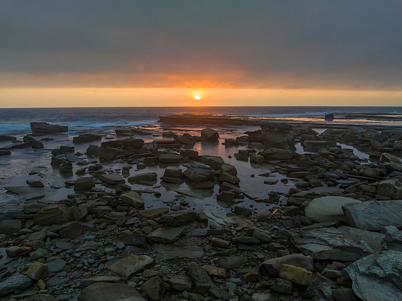 Hazy Summer Sunrise Seascape and Rocky Inlet