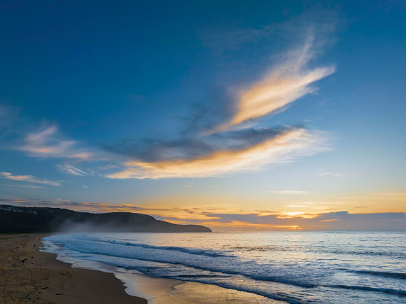 Sunrise at the seaside with pretty clouds