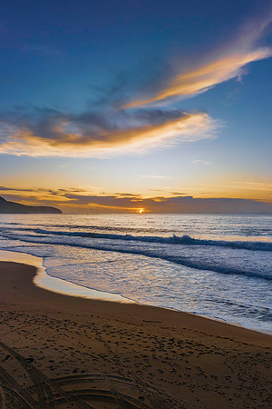 Sunrise at the seaside with pretty clouds
