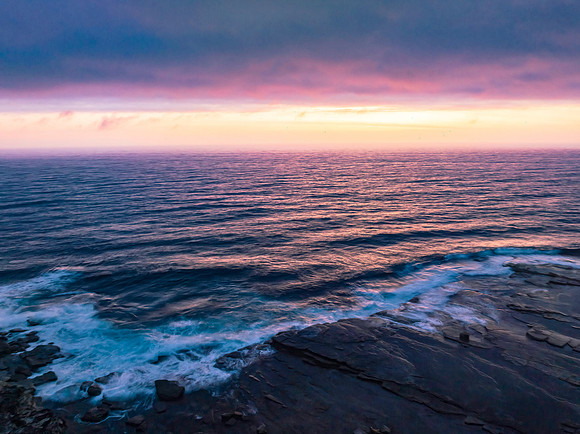 Hazy Summer Sunrise Seascape and Rocky Inlet
