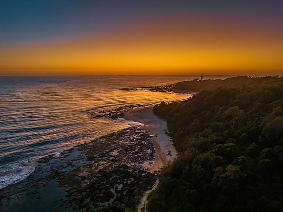 Sunrise over the sea and bay with clear skies