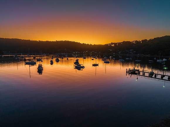 Sunrise waterscape over the bay nestled at the foot of the mount