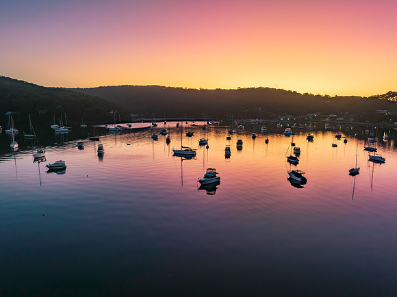 Sunrise waterscape over the bay nestled at the foot of the mount
