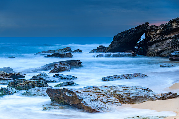 Sunrise at the seaside with rocks and beautiful diffused light b