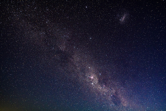 The night sky and Milky Way Galaxy with satellites