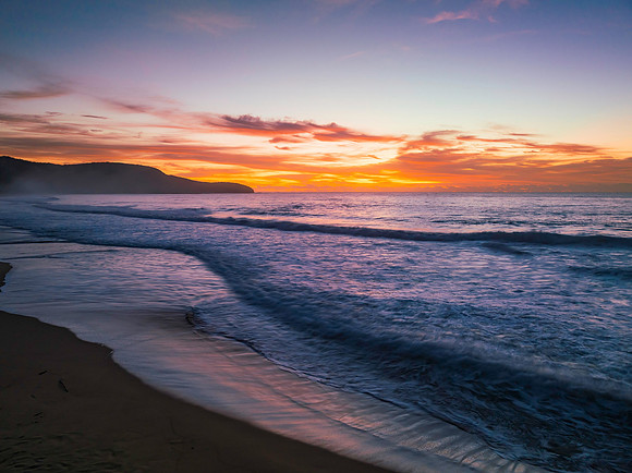 Sunrise at the seaside with pretty clouds
