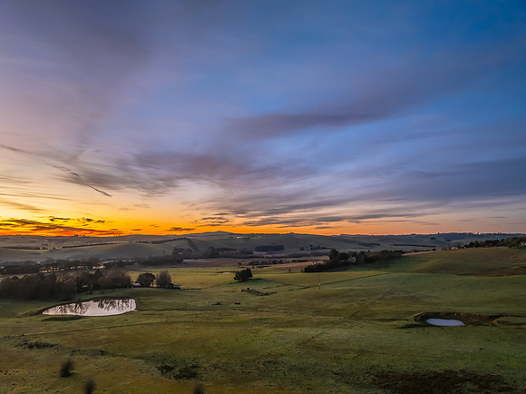 Winter Sunrise over the rural countryside with high cloud