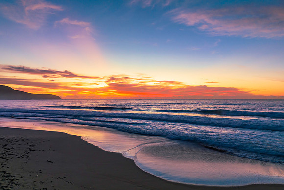 Sunrise at the seaside with pretty clouds