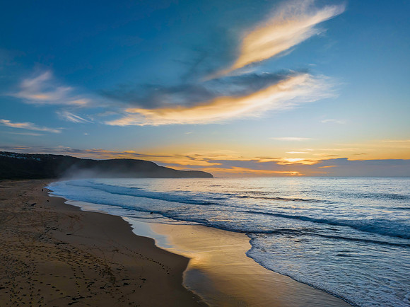 Sunrise at the seaside with pretty clouds