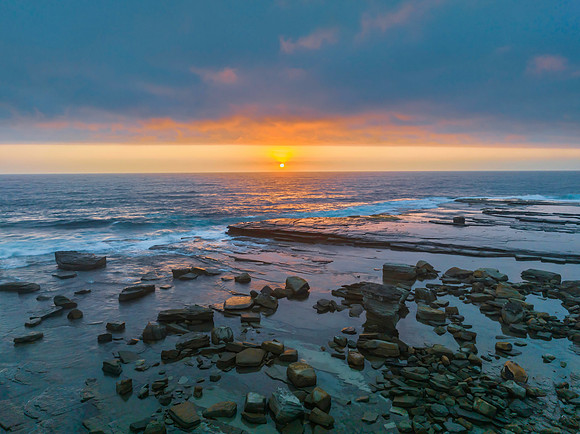 Hazy Summer Sunrise Seascape and Rocky Inlet