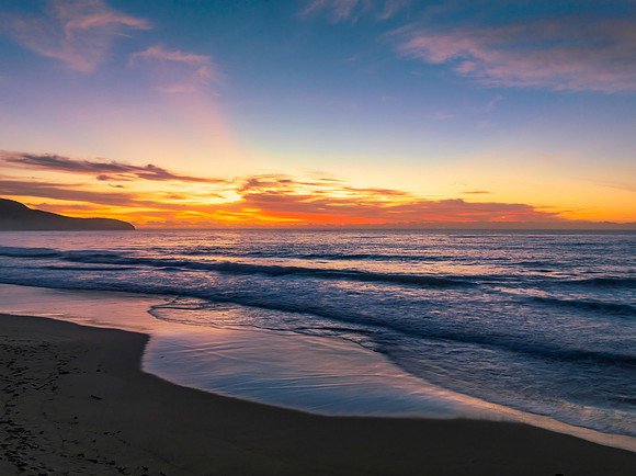 Sunrise at the seaside with pretty clouds