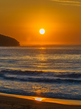 Soft hazy sunrise seascape and orange sky and full sun