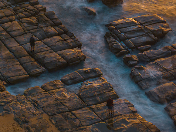 Aerial sunrise seascape with  high tide and rock platform