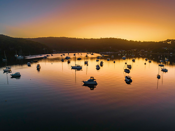 Sunrise waterscape over the bay nestled at the foot of the mount