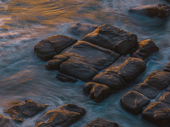 Aerial sunrise seascape with  high tide and rock platform