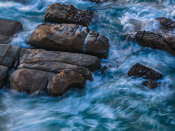 Aerial sunrise seascape with  high tide and rock platform
