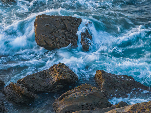 Aerial sunrise seascape with  high tide and rock platform