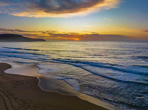 Sunrise at the seaside with pretty clouds