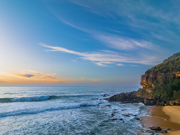 Sunrise at the seaside with pretty clouds