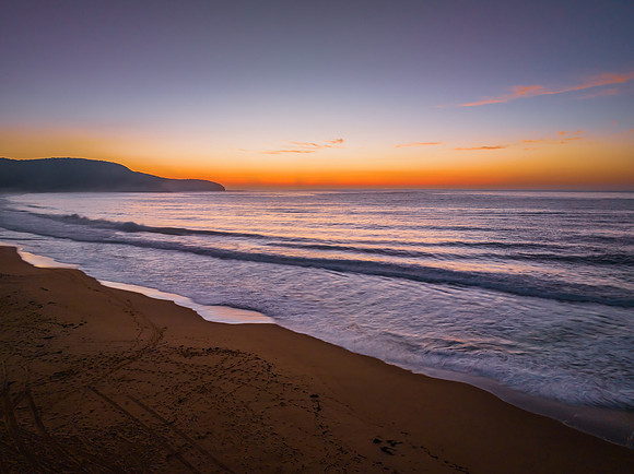 Soft hazy sunrise seascape and vibrant horizon