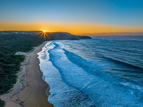 Sunrise and waves at the seaside