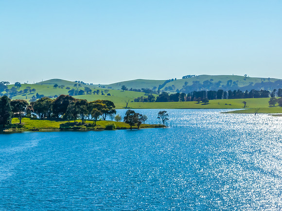 Aerial scenic views over Carcoar Dam with blue sky