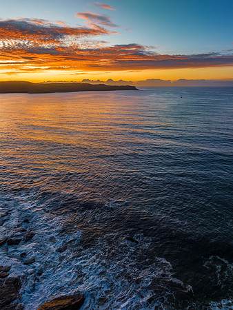 Aerial sunrise seascape with high cloud