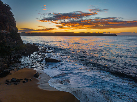 Aerial sunrise seascape with high cloud