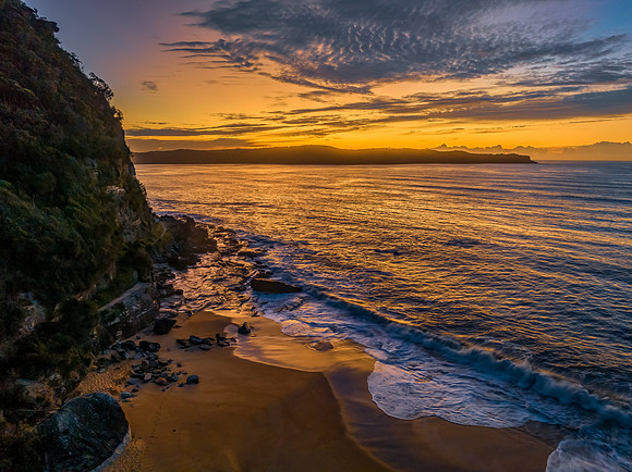 Aerial sunrise seascape with high cloud