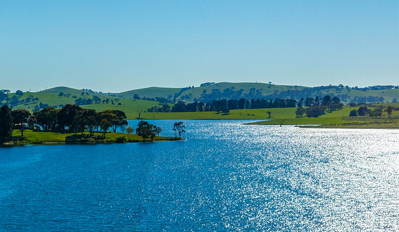 Aerial scenic views over Carcoar Dam with blue sky