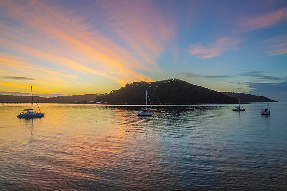 Aerial sunrise waterscape with boats