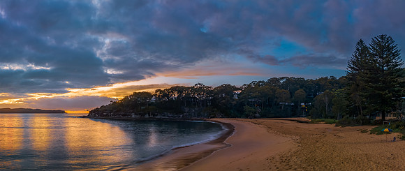 Aerial sunrise seascape with calm seas and a mix of high and low