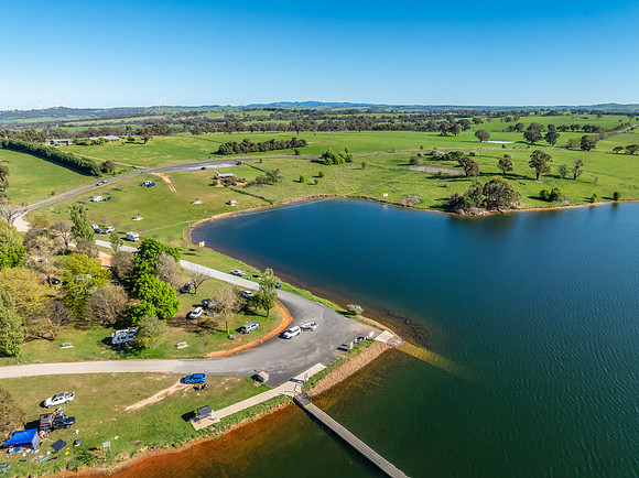 Aerial scenic views over Carcoar Dam with blue sky