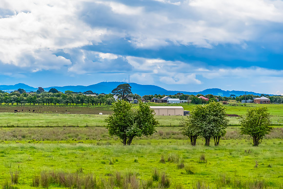 Spring landscape in the countryside with rain clouds